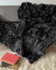 Luxury obsidian black shearling throw, premium Toscana sheepskin rug, stylish dark fur super king bed throw, handcrafted sustainable decor by Wildash London at brixbailey.com