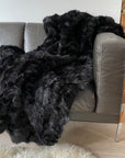 Luxury obsidian black shearling throw, premium Tuscan sheepskin rug or super king bed throw, handcrafted and sustainable by Wildash London at brixbailey.com
