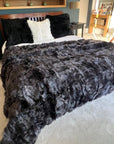 Luxury obsidian black shearling throw or rug, premium Tuscan sheepskin, stylish dark highlights, best-selling super king size by Wildash London at brixbailey.com