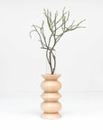 bold modern totem vase in solid beech wood with a sleek glass insert