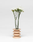 bold statement totem vase in solid beech wood with a sleek glass center
