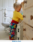 Premium organic cotton kids yoga pants with floral print, dark blue with snowdrops daisies and tulips, soft comfortable waistband and cuffs, GOTS certified by Toby Tiger at brixbailey.com