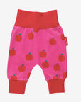 Premium organic cotton kids yoga pants with red apple print, stylish contrast pink waist and ankle cuffs, soft GOTS certified fabric by Toby Tiger at brixbailey.com
