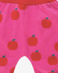 Premium organic cotton kids yoga pants with apple print, stylish red and pink contrast trim, soft comfortable waistband, eco-friendly GOTS certified by Toby Tiger at brixbailey.com