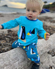 Premium kids yoga pants with arctic animal print, soft organic cotton, comfortable waist and ankle cuffs, best-selling eco-friendly design by Toby Tiger at brixbailey.com