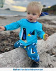 Premium kids yoga pants with arctic animal print, soft organic cotton, comfortable ankle cuffs, stylish and breathable by Toby Tiger at brixbailey.com