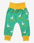 Premium organic cotton kids yoga pants with duck print, playful green and yellow design, soft GOTS-certified fabric, comfortable waistband and cuffs by Toby Tiger at brixbailey.com