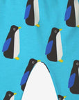 Premium baby blue organic cotton yoga pants with penguin print, elastic waistband, ankle cuffs, soft GOTS-certified fabric by Toby Tiger at brixbailey.com