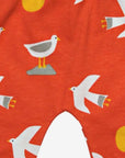 Women's organic cotton yoga pants with seagull print by Toby Tiger in vibrant orange at www.brixbailey.com