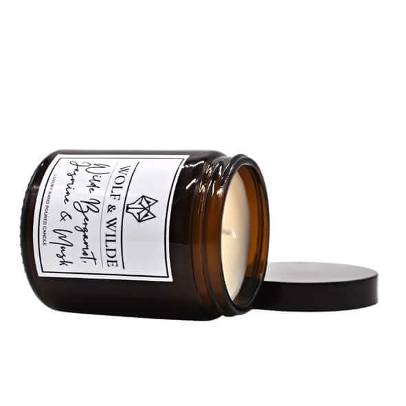 Luxury handmade UK candle with bergamot jasmine musk scent, premium natural wood wax, aromatic blend top middle base notes by Wolf & Wilde at brixbailey.com