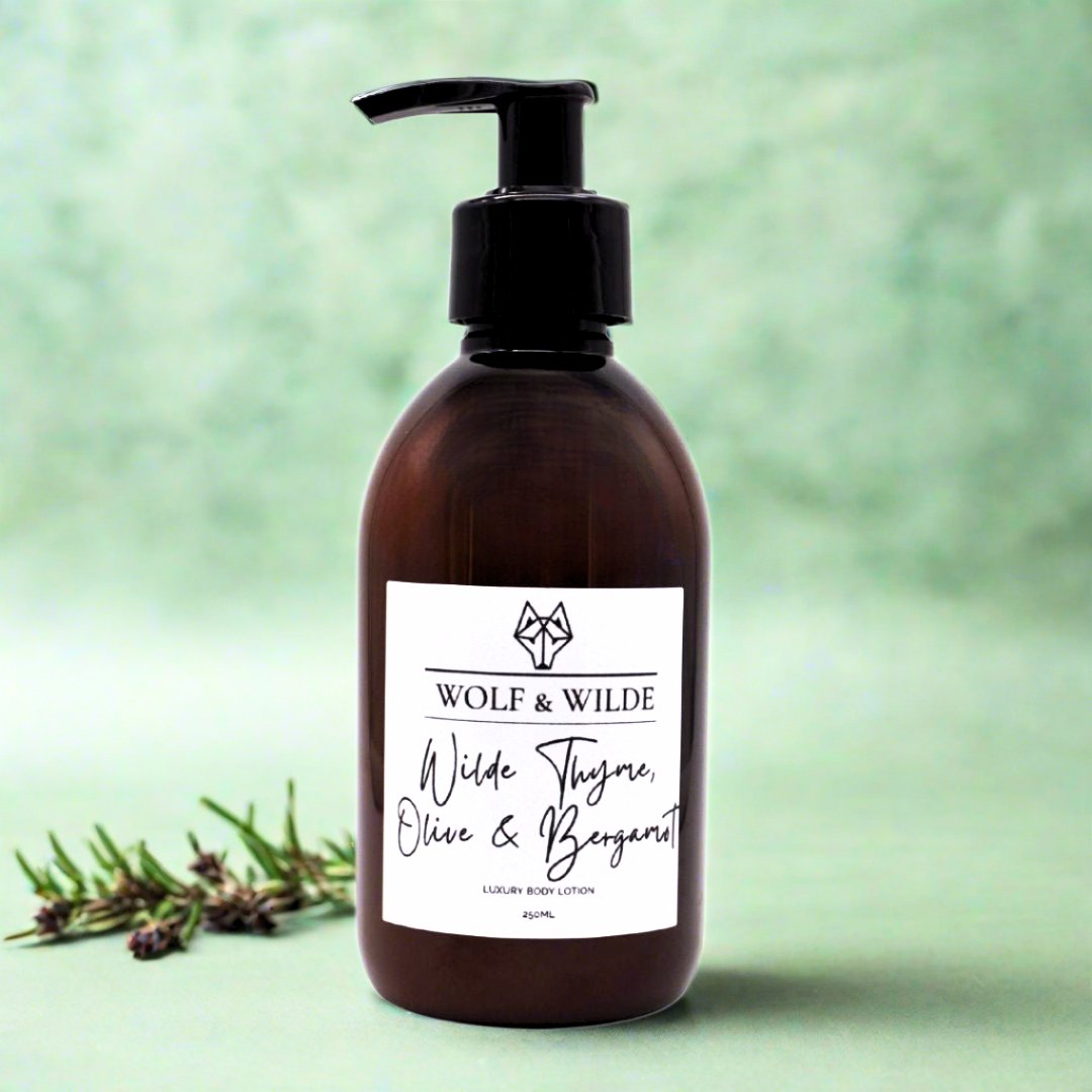 Luxury citrus floral body lotion with orange, bergamot, green apple, rose, jasmine, amber, and musk in recyclable amber bottle by Wolf & Wilde at brixbailey.com