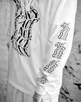 Luxury oversized off-white long sleeve with matte black graphics, premium 200 gsm organic cotton, handcrafted limited edition by WWOOLLFF CO. at brixbailey.com