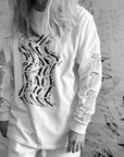Luxury oversized off-white long sleeve with matte black graphics, premium 200 gsm organic cotton fabric, handcrafted limited edition by WWOOLLFF CO. at brixbailey.com