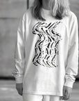 Luxury oversized off-white long sleeve with matte black graphics, premium 200 gsm organic cotton, handcrafted limited edition by WWOOLLFF CO. at brixbailey.com