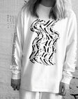 Luxury oversized off-white long sleeve with matte black graphics, premium 200 gsm organic cotton, handcrafted limited edition unisex top by WWOOLLFF CO. at brixbailey.com