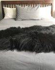 Icelandic natural black undyed sheepskin hide, premium eco-tanned luxury rug, sustainably sourced, soft and biodegradable by Wildash London at brixbailey.com