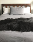 Icelandic natural black undyed sheepskin hide, premium eco-tanned luxury rug, sustainably sourced, soft and biodegradable by Wildash London at brixbailey.com