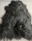 Icelandic natural black undyed sheepskin hide, premium eco-tanned luxury rug, sustainably sourced, soft and biodegradable by Wildash London at brixbailey.com
