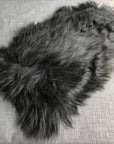 Icelandic natural black undyed sheepskin hide, premium eco-tanned luxury rug, sustainably sourced, soft and biodegradable by Wildash London at brixbailey.com