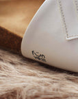 Premium white vegan sandals with comfortable straps, cushioned footbed, slip-resistant sole, sustainable fair fashion by Fünve at brixbailey.com