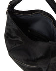 Black leather top handle shoulder bag by Brix + Bailey with silver hardware and removable tassel at www.brixbailey.com