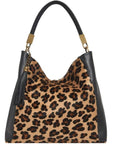 Large leopard print calf hair leather grab bag by Sostter with removable crossbody strap at www.brixbailey.com
