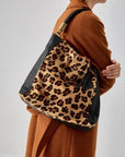 Large leopard print calf hair leather grab bag by Sostter with removable strap at www.brixbailey.com