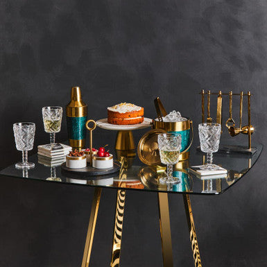 Table with glasses and pates and cutlery illustrating the independent brands, boutiques and creators Brix + Bailey works with.
