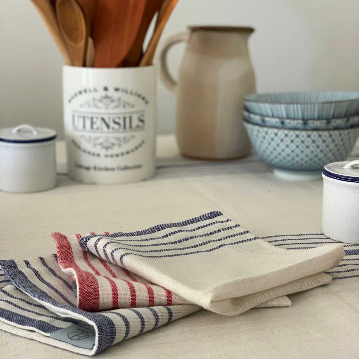 Sustainable kitchen towels and natural materials arranged on a shelf