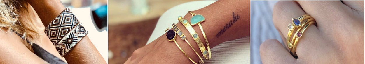 Azuni London 24ct gold plated bangles and drop earrings set with semi-precious stones, arranged on a neutral surface