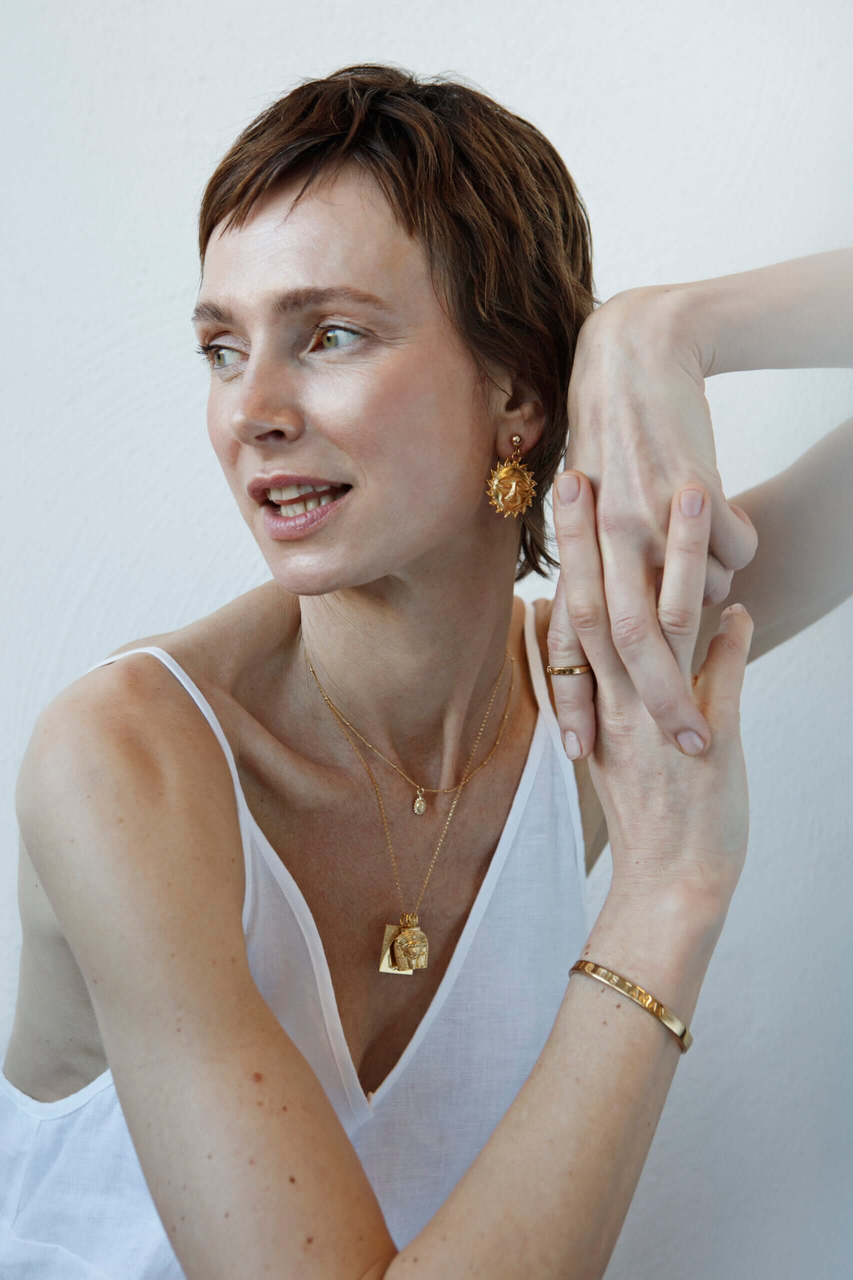 Close up of handmade rings and necklaces on skin — independent jewelry designers and artisan makers | Brix + Bailey