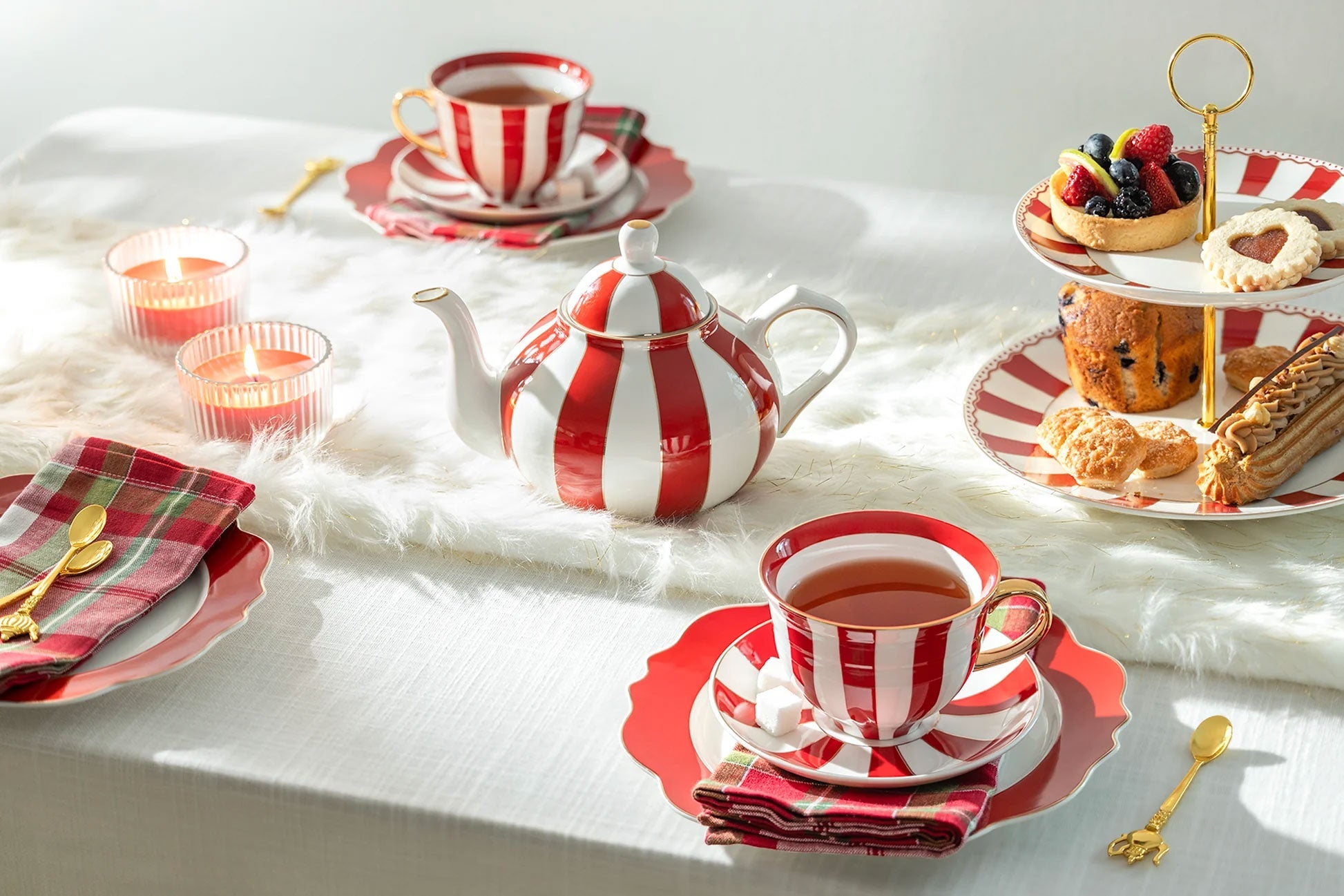 A laid table with hand-finished ceramic plates, sculptural serveware and crystal tumblers