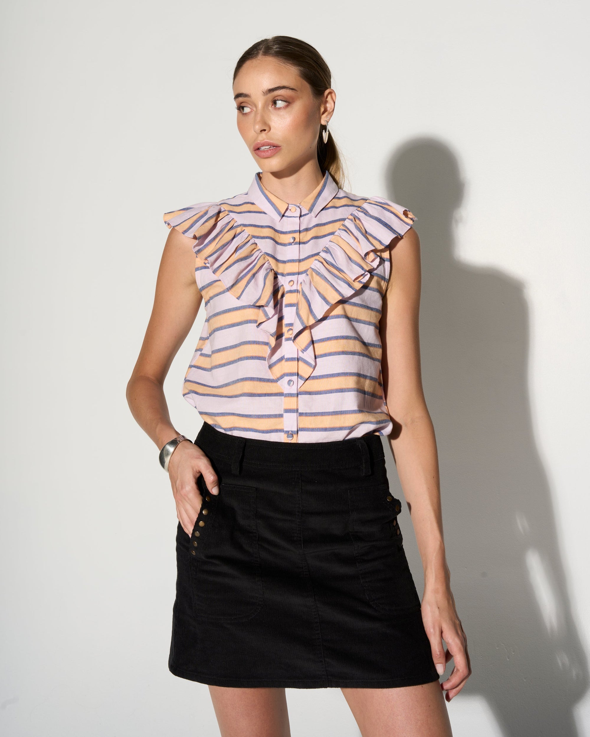 Premium striped ruffle blouse, feminine and edgy, handcrafted cotton, luxury flutter sleeve, best-selling summer top by GILD at brixbailey.com