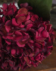 Lifelike ruby red hydrangea stem with hand-painted petals, 42cm tall, realistic plastic texture for home decor by Sostter at brixbailey.com