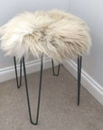 Luxury British sheepskin seat cover, 100% natural premium round hide, 35cm diameter, cream with light browns, handcrafted, sustainable, hypoallergenic by Wildash London at brixbailey.com