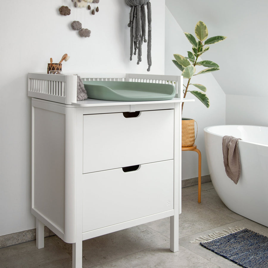 Premium Sebra changing mat in seagrass green, stylish Scandinavian design, soft water-repellent surface, safe baby nest shape, easy to clean by Ella James at brixbailey.com