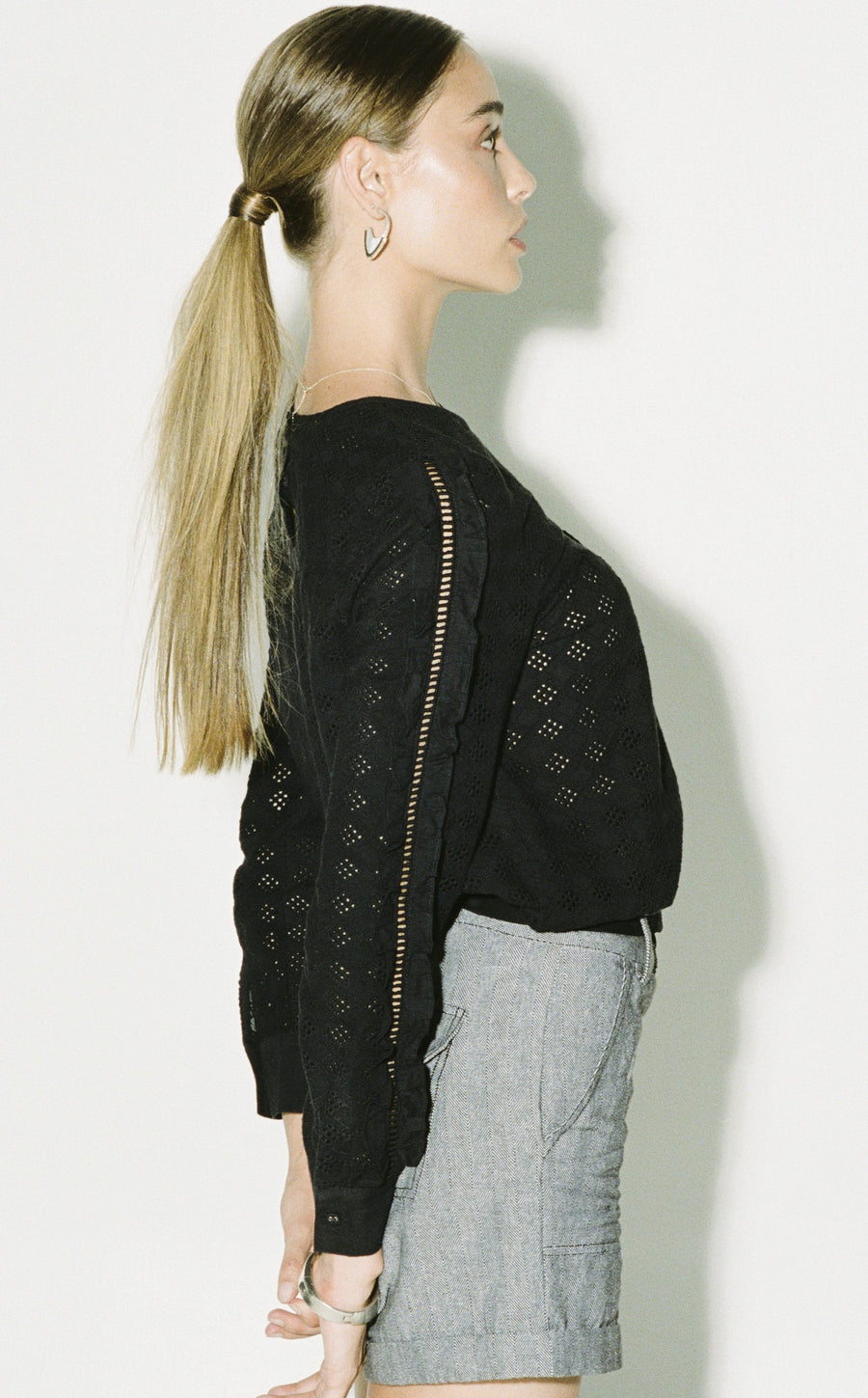 Black ruffled blouse, luxury puff sleeve top with lace inserts, premium eyelet fabric, romantic and edgy design, best-selling fashion by GILD at brixbailey.com