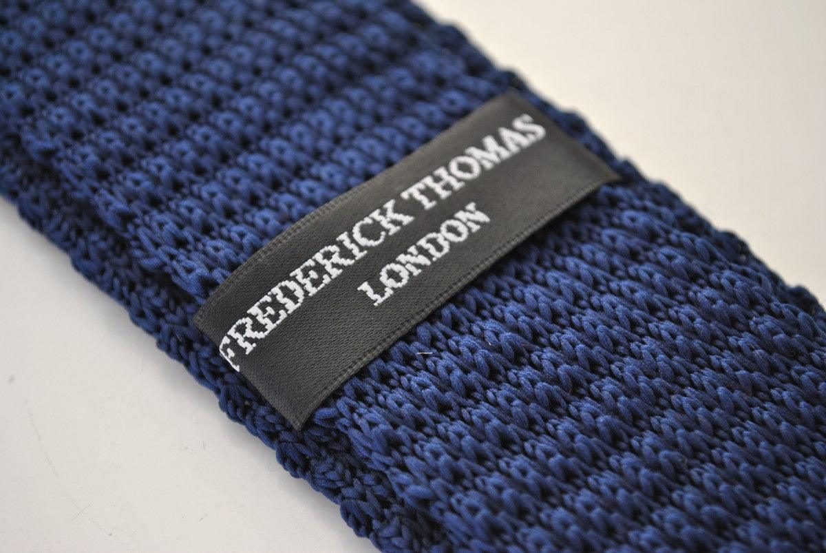 navy blue skinny knitted tie with white polka dots