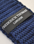 navy blue skinny knitted tie with white polka dots