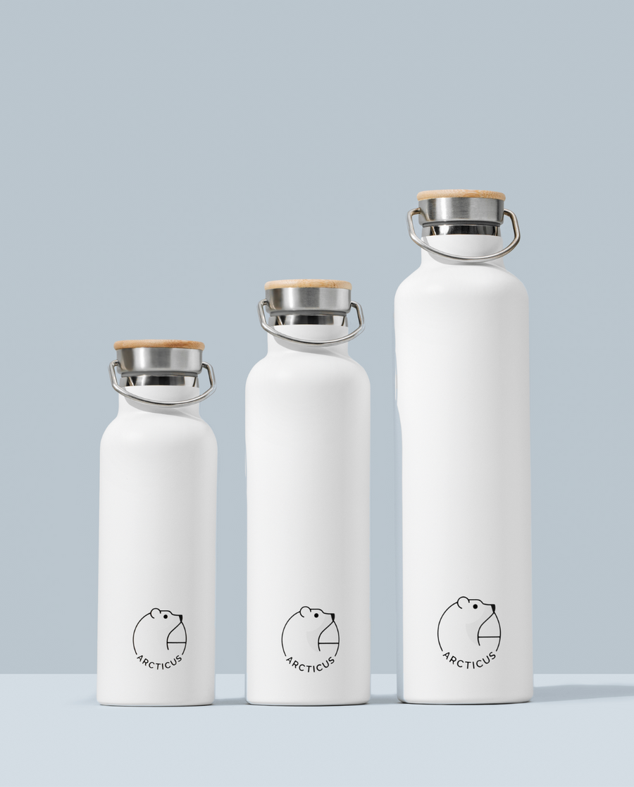 Premium Arctic Bottle, double-wall vacuum-insulated stainless steel water bottle, keeps drinks hot 12h cold 24h, eco-friendly bamboo lid, BPA-free, leak-proof, biodegradable packaging by Arcticus at brixbailey.com