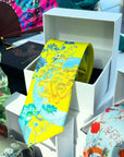 Vibrant yellow and pale blue ‘Luciferin’ floral silk tie