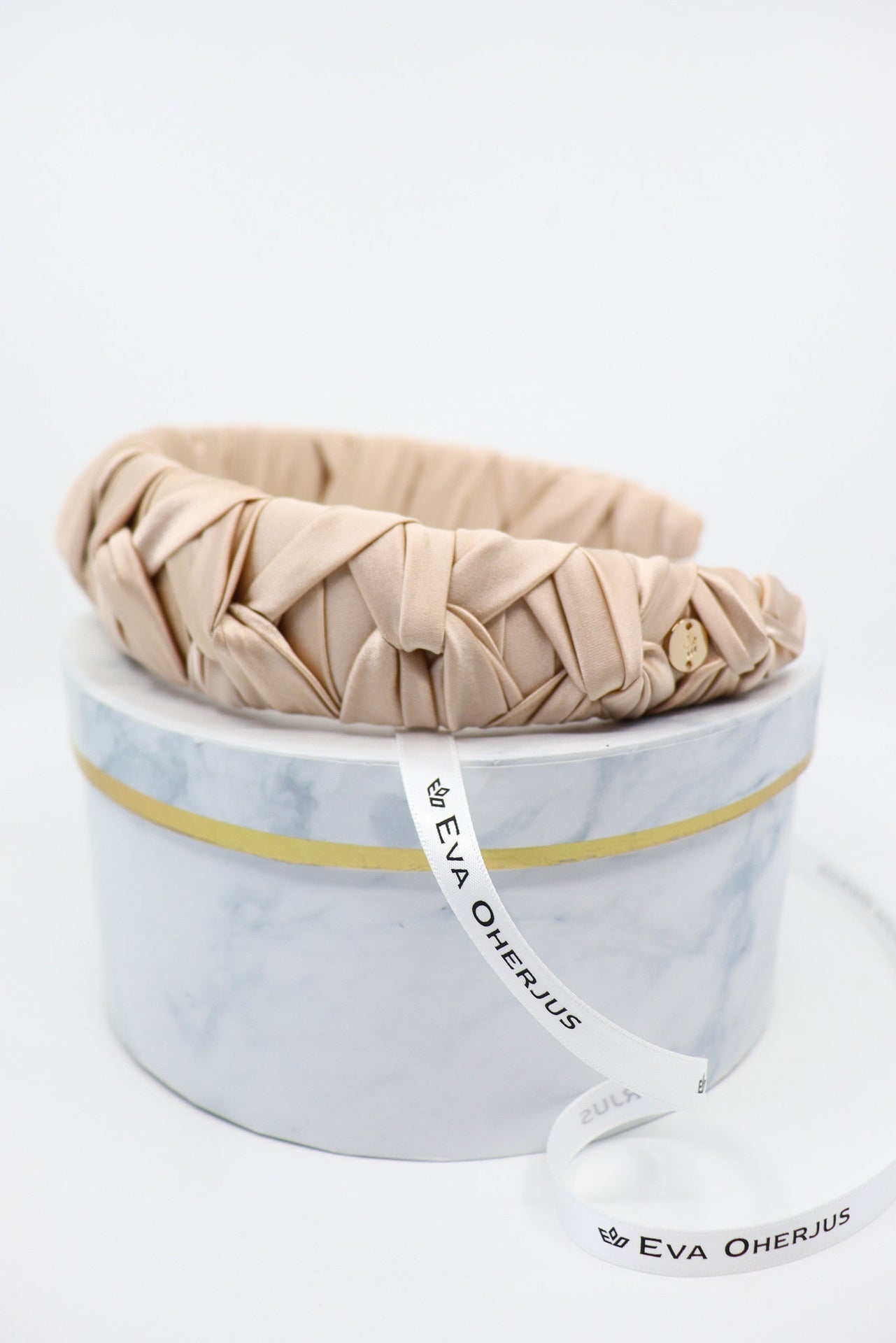 Light Beige Silk Knotted Headband - Crown Design with Metal Logo Tag - Elegant & Durable by Eva Oherjus at www.brixbailey.com