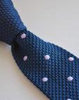 navy blue skinny knitted tie with lilac purple polka dots