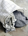 Premium black and white squares laundry bag, stylish smart storage with handles, wired shape-retaining design, foldable for compact storage by Ella James at brixbailey.com