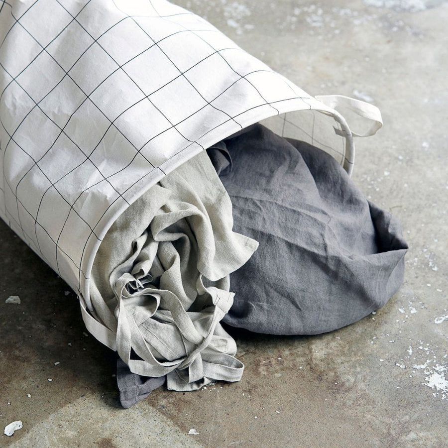 Premium black and white squares laundry bag, stylish smart storage with handles, wired shape-retaining design, foldable for compact storage by Ella James at brixbailey.com