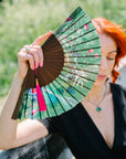 Green hand-held silk fan with 'Greenery' mushroom and crystal botanical artwork