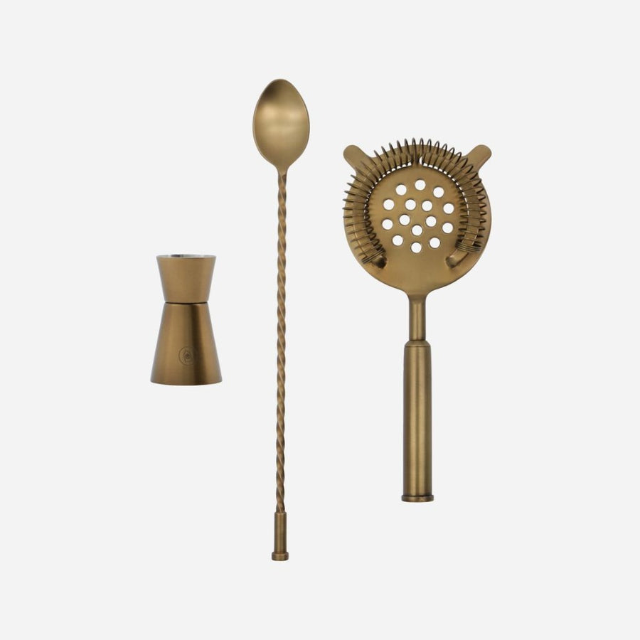 Premium antique brass cocktail set, stylish stainless steel bar tools with measuring cup, strainer, shaker, ice bucket, tongs by Ella James at brixbailey.com