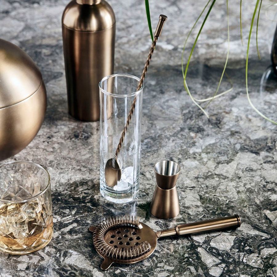 Luxury six-piece antique brass barware set, premium stainless steel cocktail shaker, strainer, stirrer, measuring cup, ice bucket, tongs by Ella James at brixbailey.com