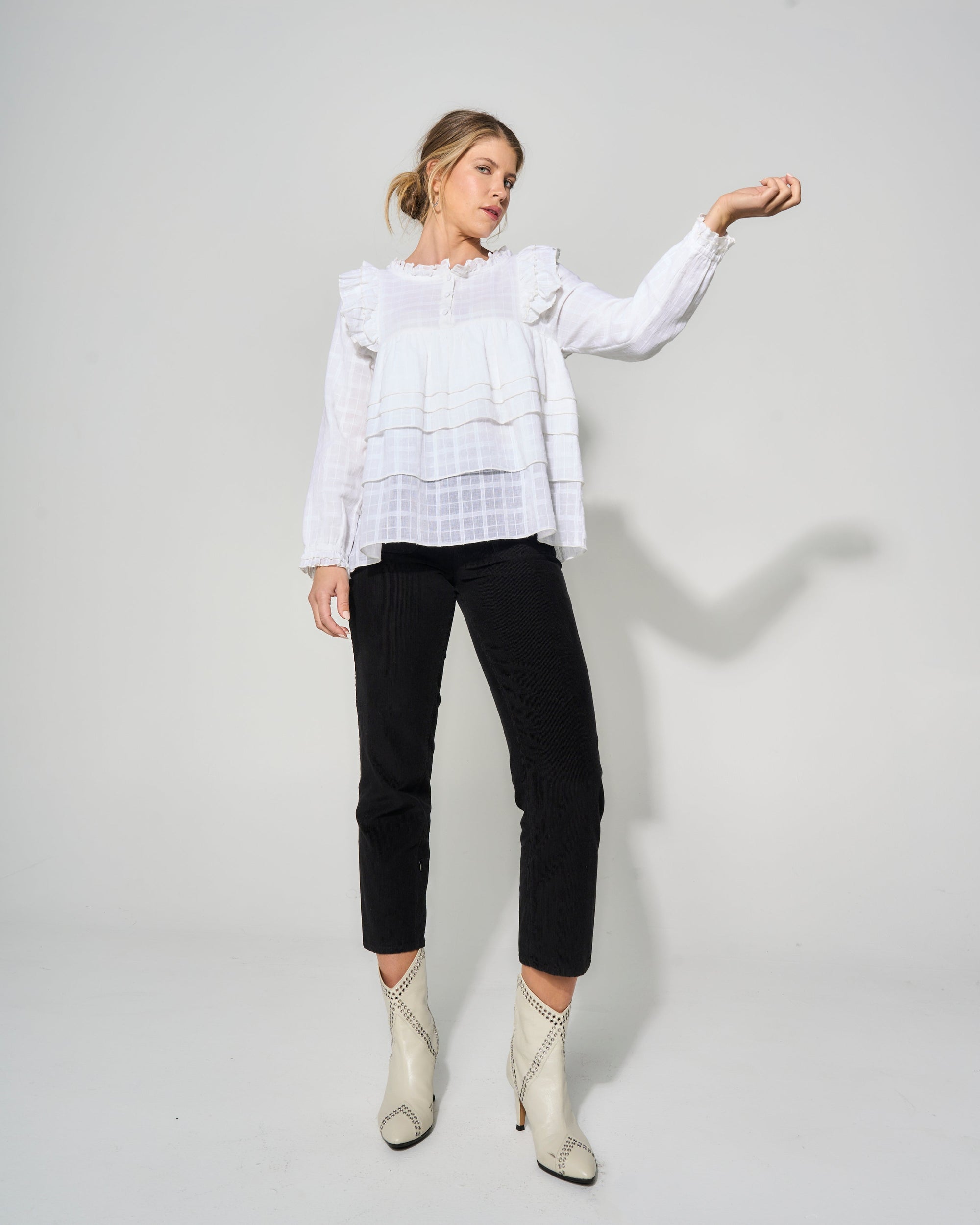 Luxury cream tiered blouse with ruffled shoulders, romantic feminine style, soft textured cotton, best-selling womens top by GILD at brixbailey.com
