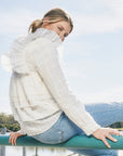 Luxury cream tiered blouse with ruffled shoulders, romantic frilled details, premium textured cotton by GILD at brixbailey.com